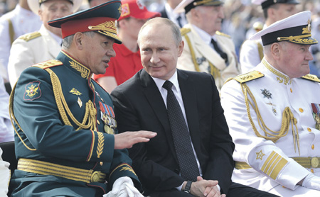 Putin flanked by Defense Minister Shoygu and Navy CINC Admiral Vladimir Korolev